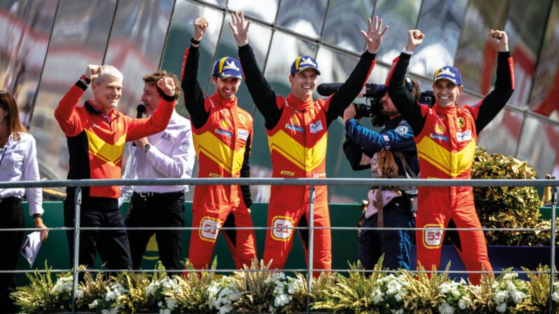 The winning Ferrari team on the podium