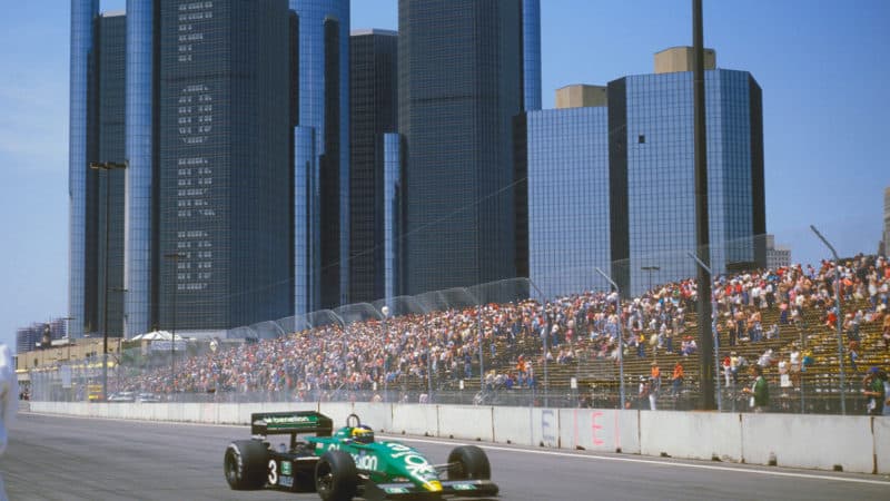 Tyrrell Ford of Michele Alboreto in front of Ford Detroit building at 1983 F1 Grand Prix