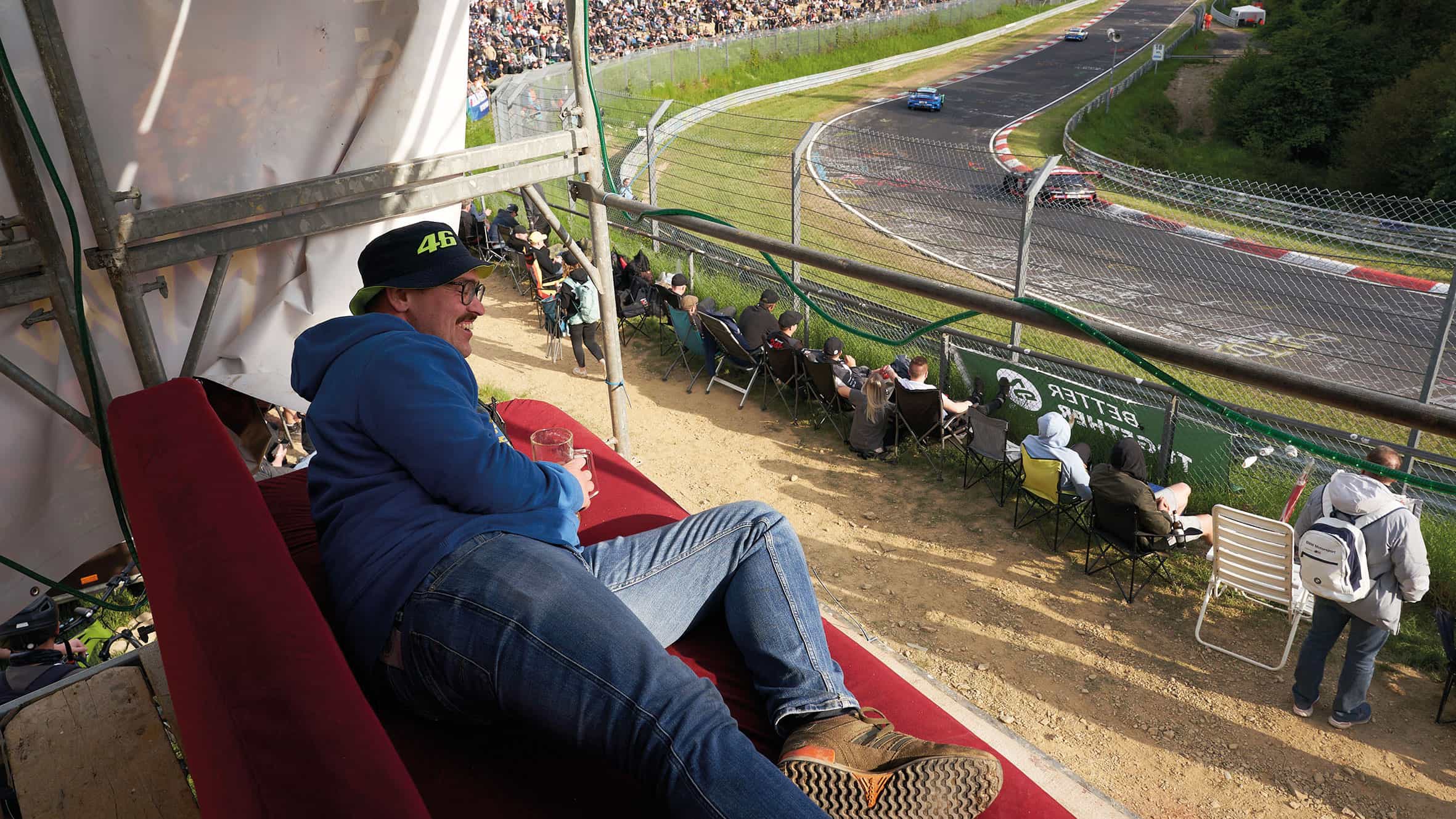 A fan takes a rest on a sofa perched
