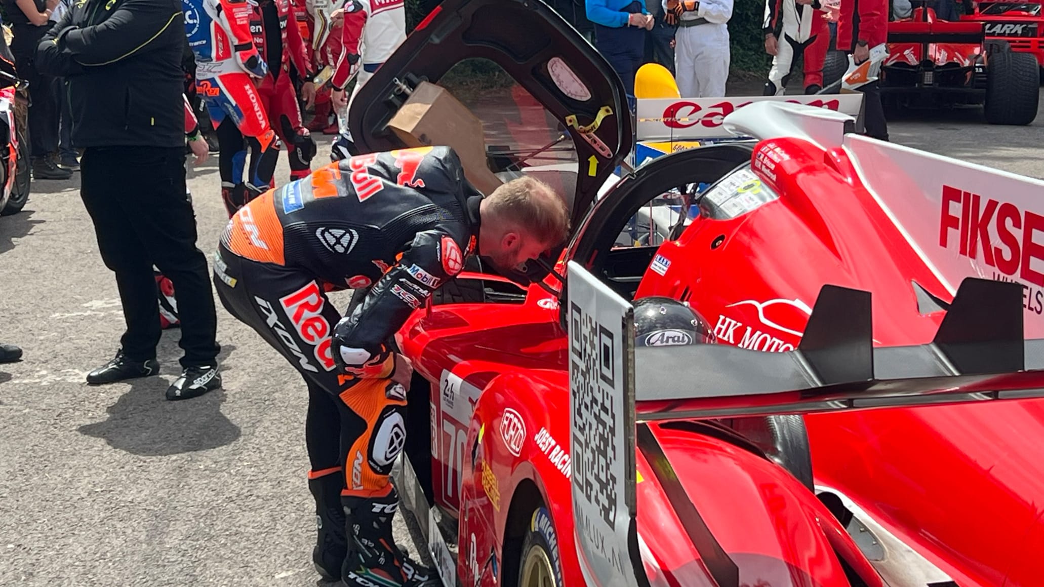 Brad Binder examines the cockpit of Le Mans Hypercar
