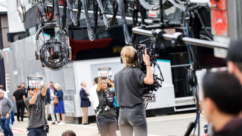 Clapper boards and film camera in 2023 British Grand Prix paddock for APXGP filming