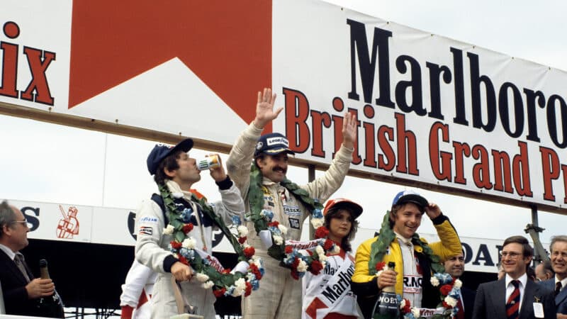 Clay Regazzoni on the Silverstone podium after winning 1979 British Grand Prix at Silverstone