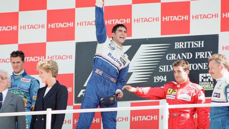 Damon-Hill-raises-his-fist-in-celebration-after-winning-1994-British-Grand-Prix