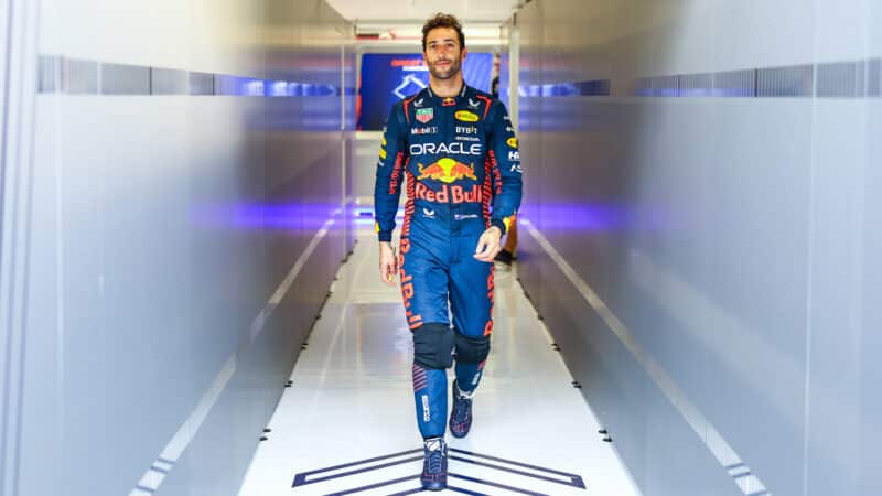 Daniel-Ricciardo-walks-through-Red-Bull-pit-garage-at-2023-Silverstone-testing