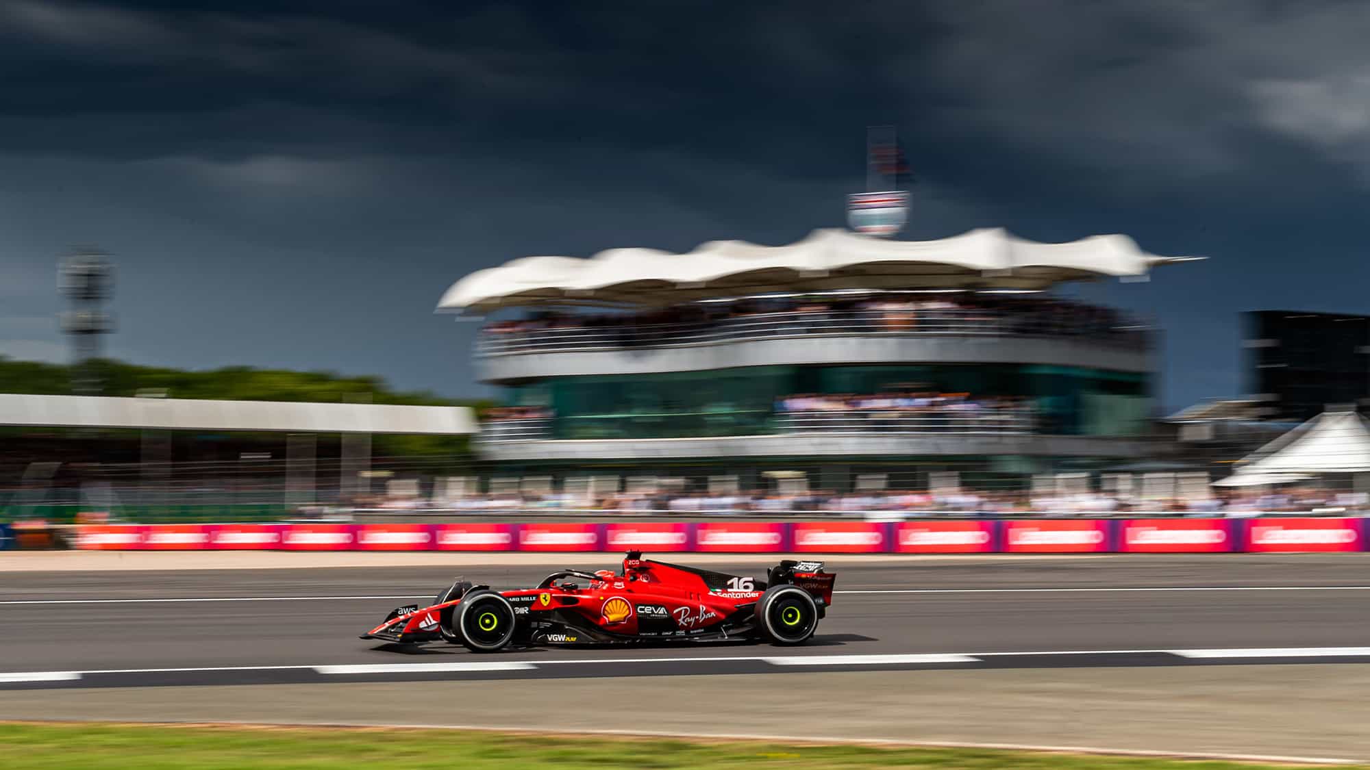 Ferrari of Charles Leclerc under stormy skies at the 2023 British Grand Prix
