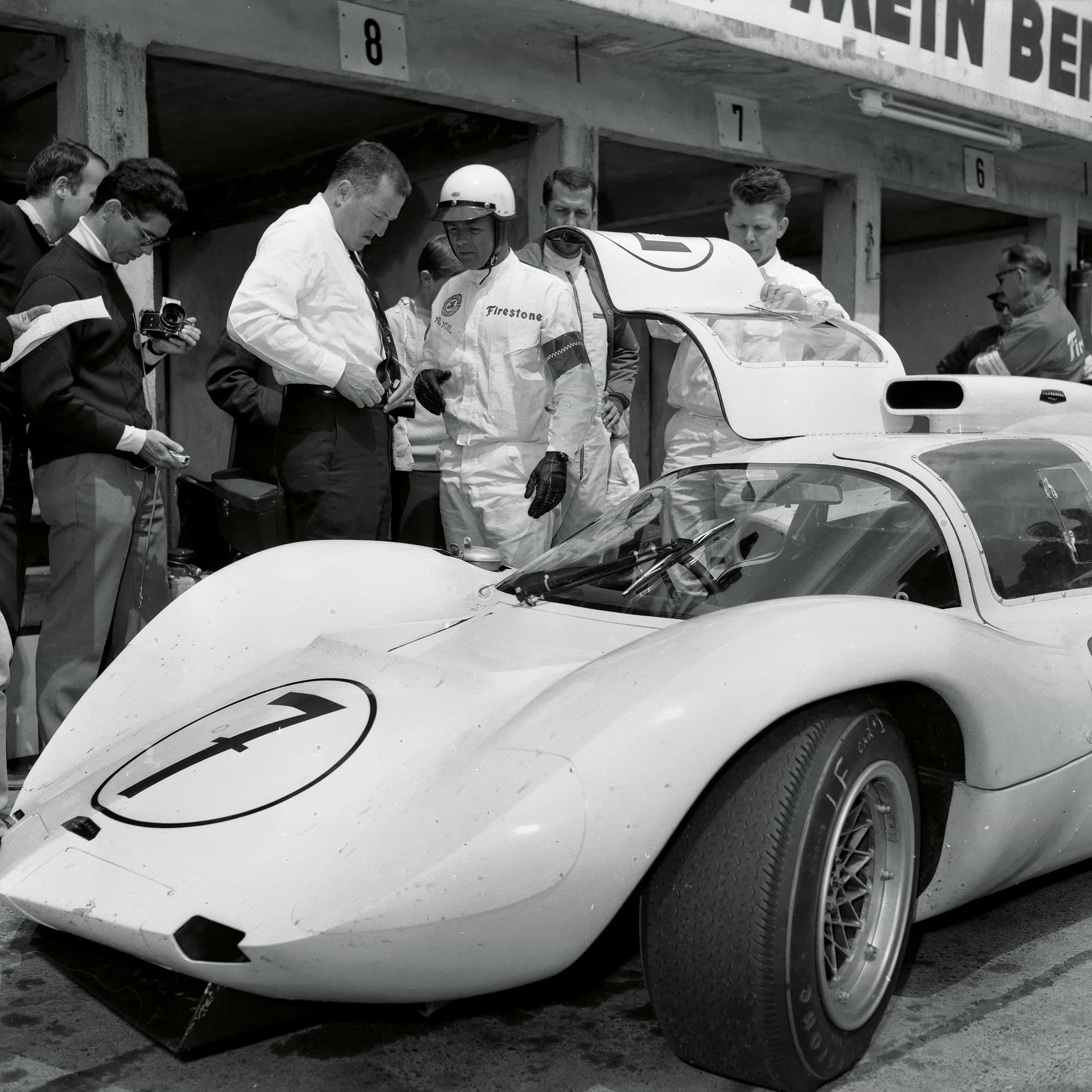 Phil Hill 1966 stands by car