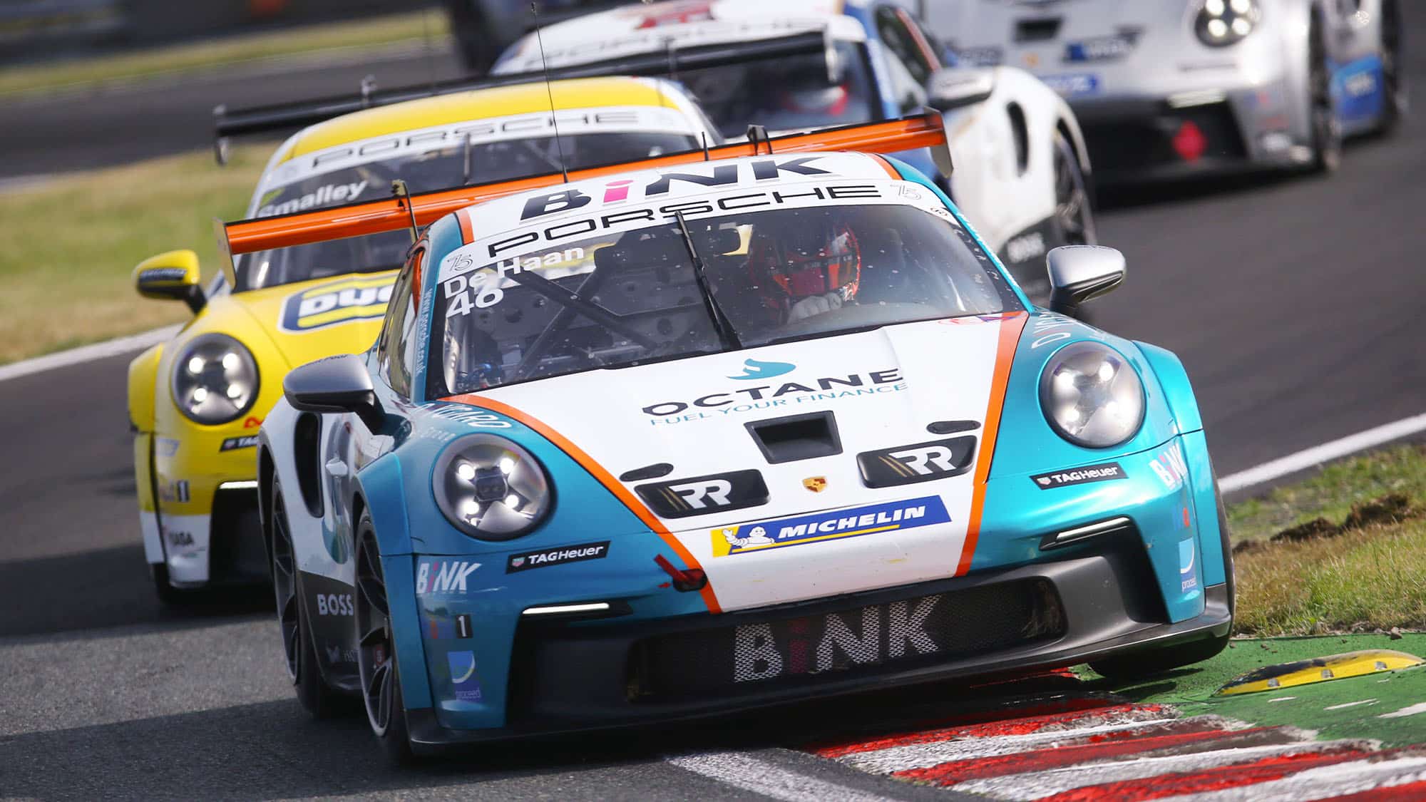 Robert de Haan leads a line of cars at 2023 Oulton Park Porsche Supercup round