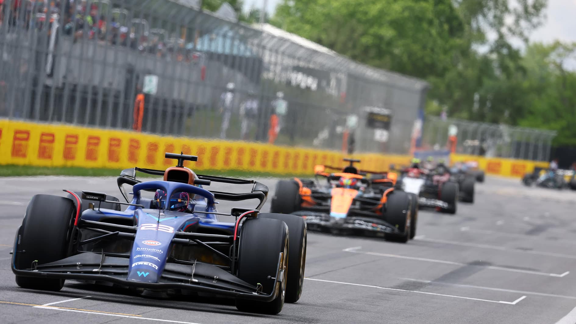 Alex Albon leads a line of cars at 2023 Canadian Grand Prix