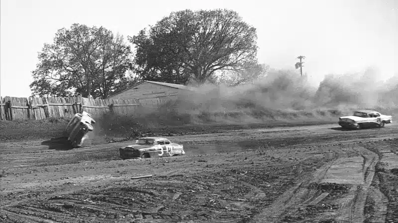 Buick of Herb Thomas rolls in 1955 NASCAR race at Charlotte