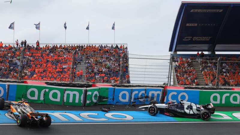 Daniel Ricciardo crashes his AlphaTauri next to spun McLaren of Oscar Piastri in practice for 2023 Dutch Grand Prix