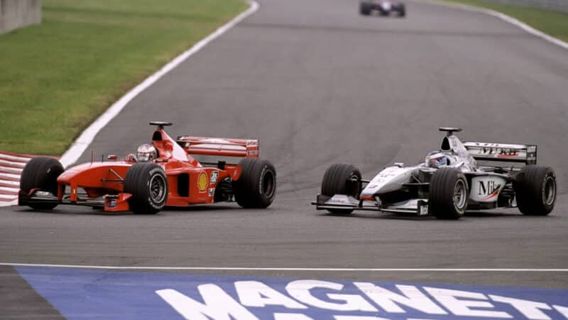 Michael Schumacher passes Mika Hakkinen in the 1999 French Grand Prix