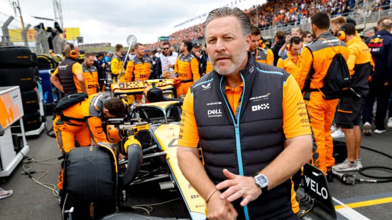 Zak Brown on 2023 Dutch Grand Prix grid in front of McLaren F1 car