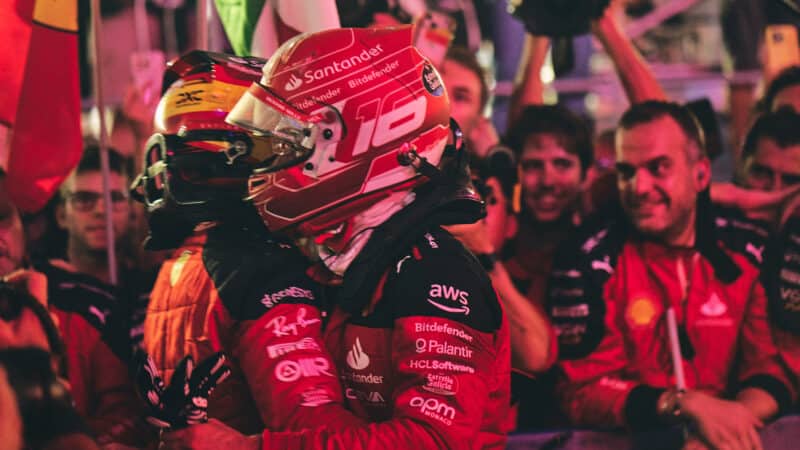 Carlos Sainz and Charles LEclerc embrace after Ferrari win in 2023 Singapore GP