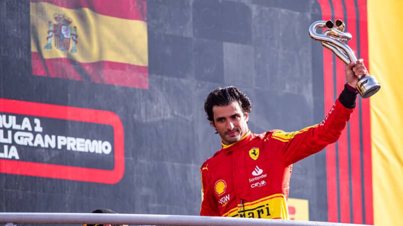 Carlos Sainz with trophy on Monza podium after 2023 italian Grand Prix