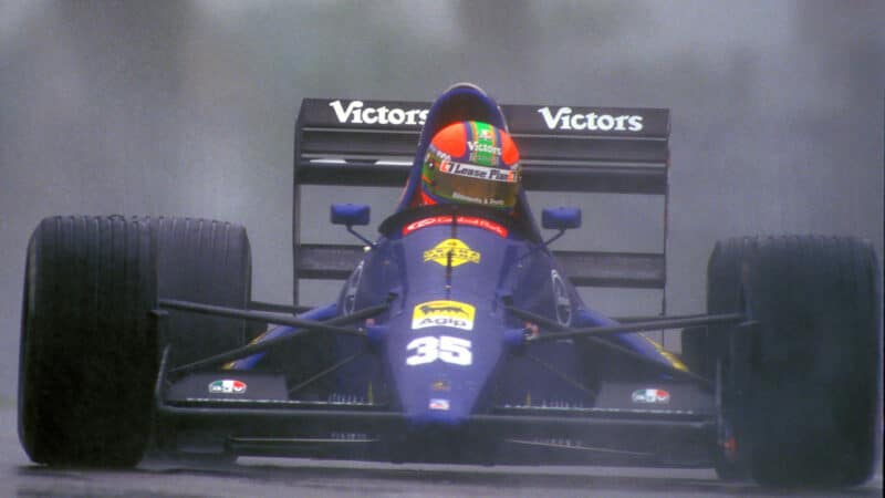 Eric van de Poele (Modena-Lamborghini) in a wet practice session before the 1991 San Marino Grand Prix