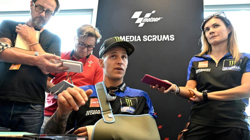 Fabio Quartararo with arm in a sling at MotoGP press conference