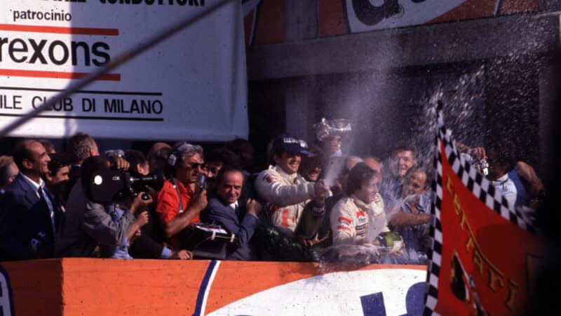 Jody Scheckter and GIlles Villeneuve spray champagne on Monza podium after 1979 Italian Grand Prix