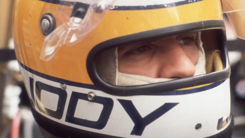 Jody Scheckter with helmet on portrait