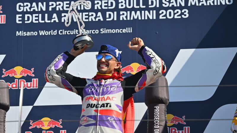 Jorge Martin on the podium with trophy after winning 2023 MotoGP San Marino GP at Misano