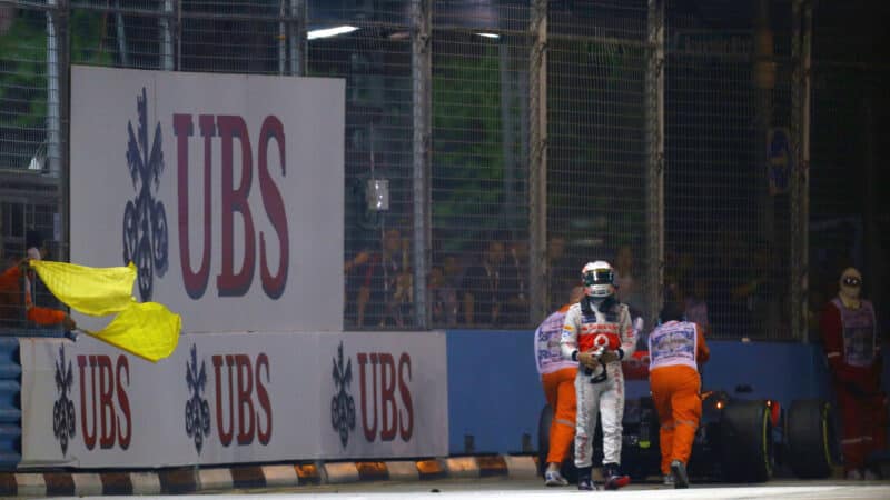 Lewis Hamilton walks away from his broken down McLaren in 2012 Singapore Grand Prix