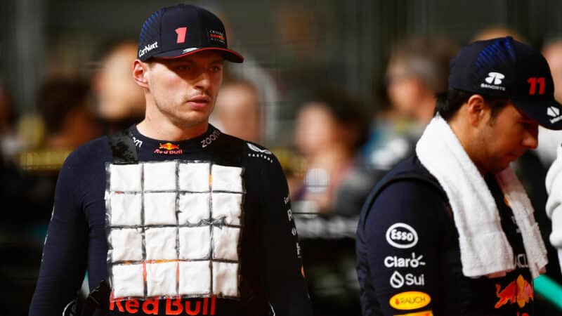 Max Verstappen wearing an ice vest with Sergio Perez alongside