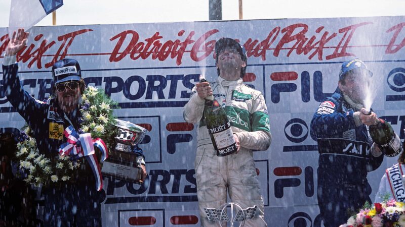 Michele Alboreto on the podium in 1983 Detroit GP