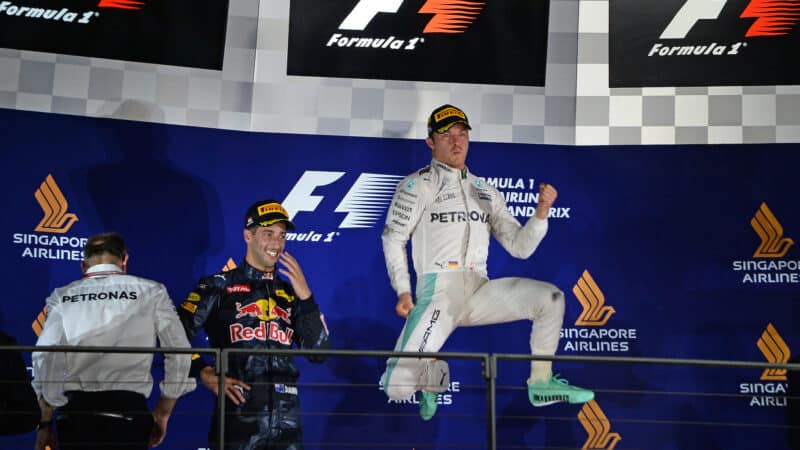 Nico Rosberg jumps up on the podium after winning the 2016 Singapore Grand Prix