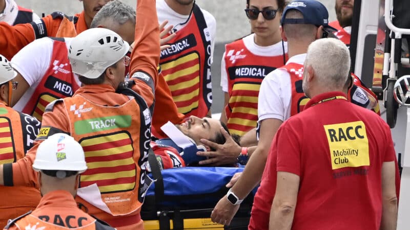 Pecco Bagnaia carried away on stretcher after 2023 MotoGP Catalan GP crash