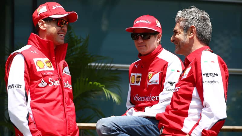 Sebastian Vettel and Kimi Raikkonen talk to Maurizio Arrivabene in 2015
