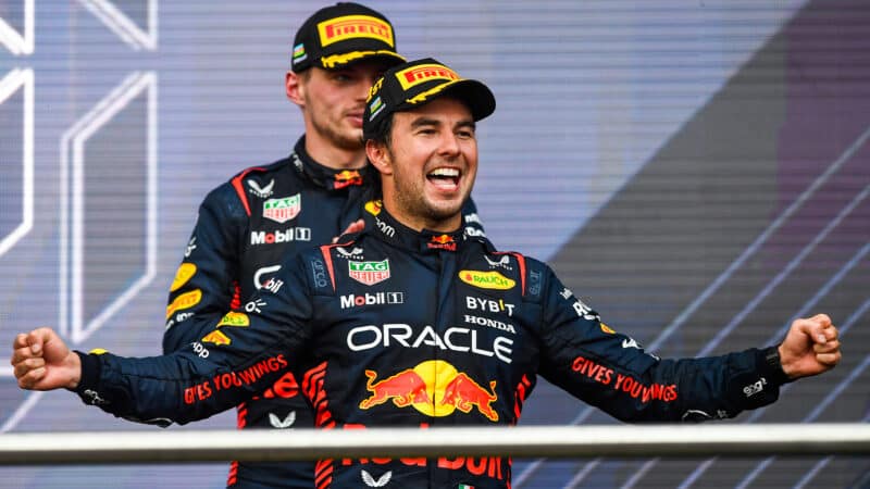 Sergio Perez celebrates as Max Verstappen claps behind him on 2023 Azerbaijan GP podium