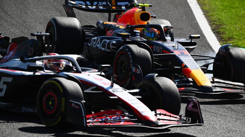 Sergio Perez locks up as he tries to pass Kevin Magnussen in 2023 Japanese Grand Prix