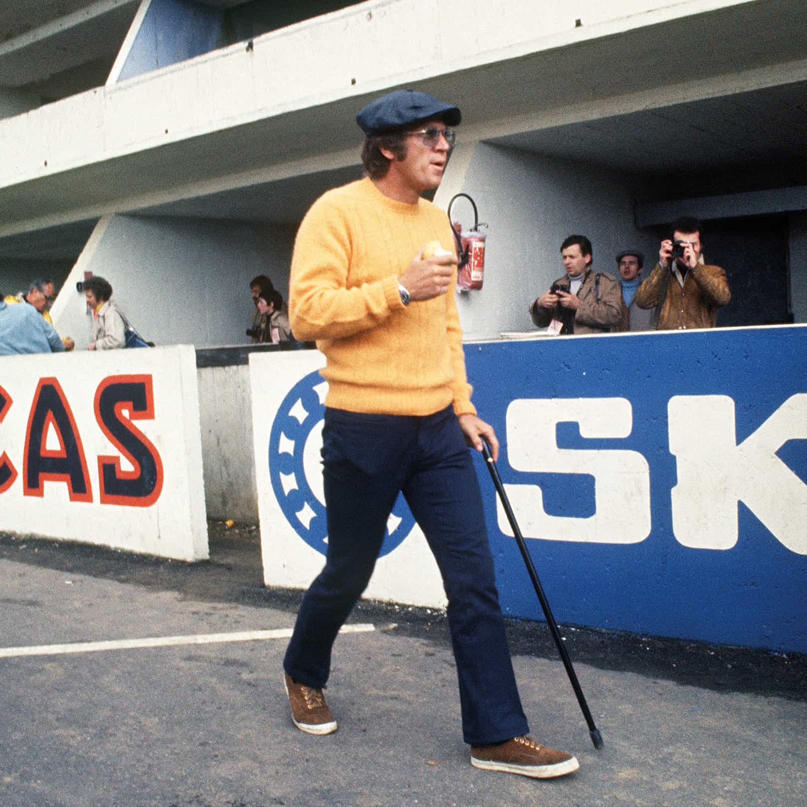 Steve McQueen walking with a cane