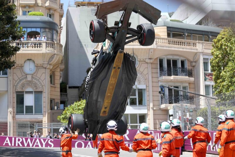 Underside-of-Mercedes-2023-F1-car-visible-as-it-is-lifted-by-a-crane-at-2023-Monaco-Grand-Prix