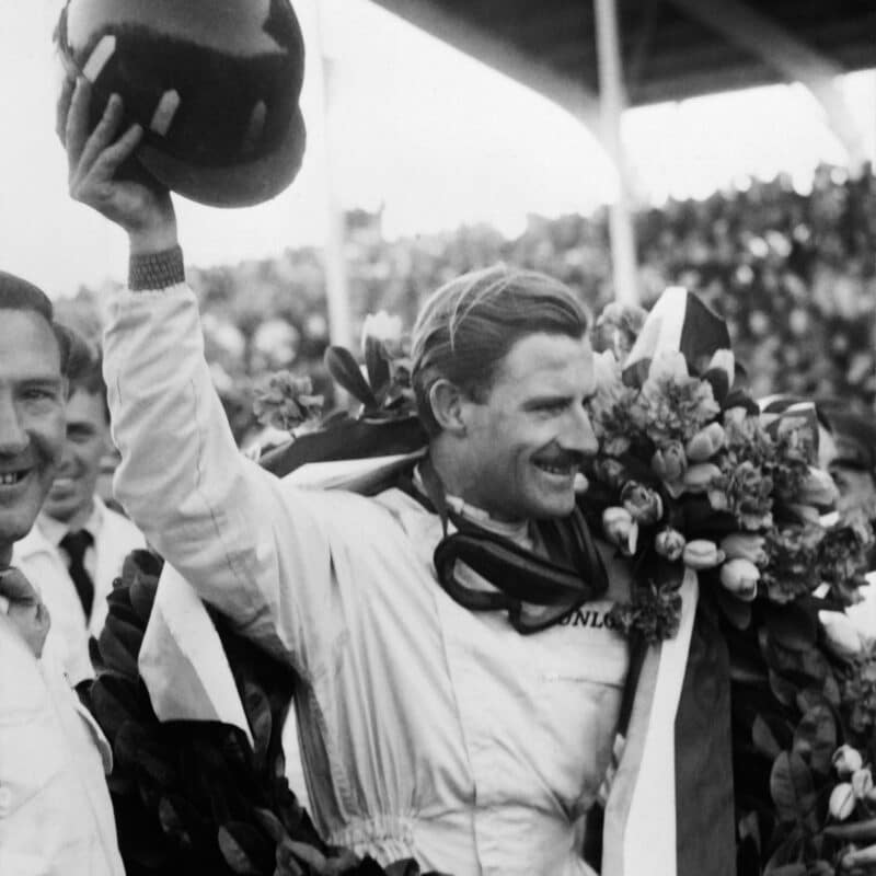 Graham-Hill-celebrates-winning-1962-F1-world-championship-at-South-African-GP-scaled