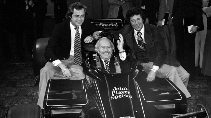 Gunnar Nilsson with Colin Chapman and Mario Andretti at launch of Lotus 78 F1 car
