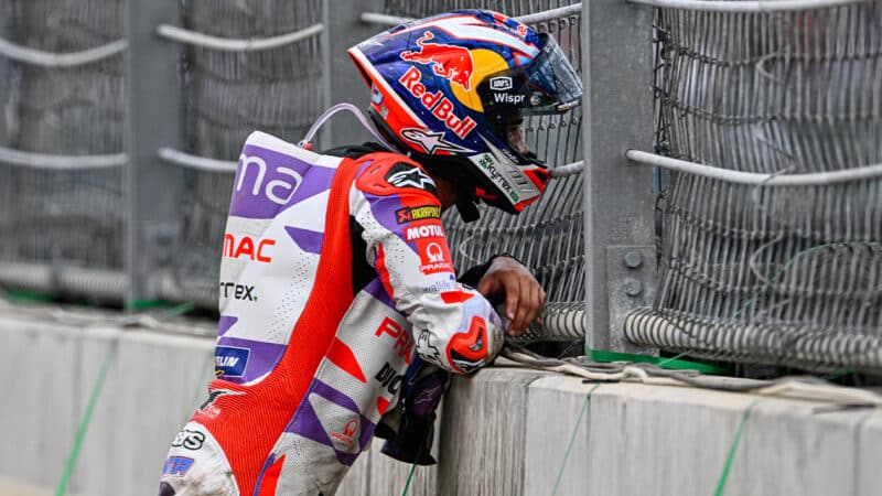 Jorge Martin leans on barrier after crashing out at 2023 MotoGP Indonesian GP