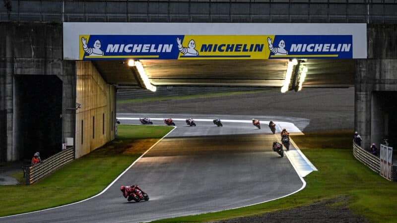 MotoGP bikes under Motegi bridge at the 2023 Japanese Grand Prix