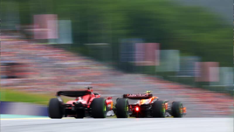 Rear view of Mclaren leading Ferrari at 2023 Austrian GP sprint