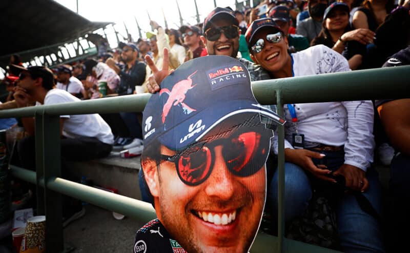 Sergio Perez fans with giant cutout of his face at 2022 Mexican Grand Prix