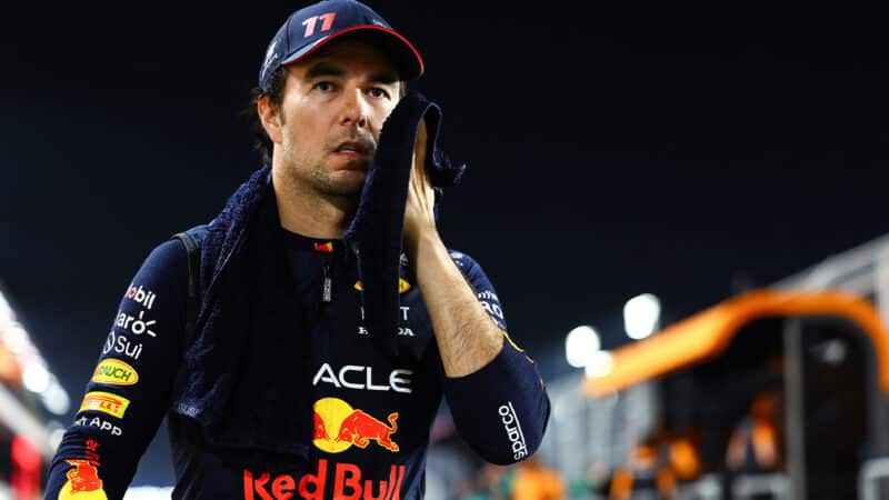 Sergio Perez wipes face with towel after 2023 Qatar Grand Prix