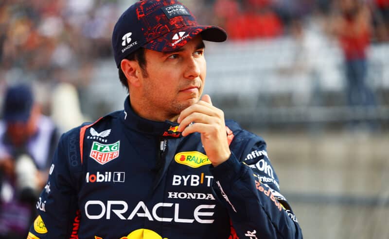 Sergio Perez with hand on chin at 2022 US Grand Prix