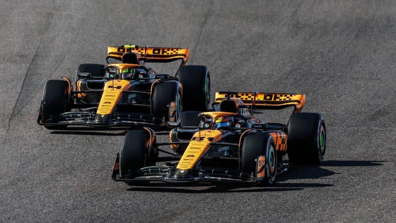 2 McLaren F1's Norris and Piastri battle on track