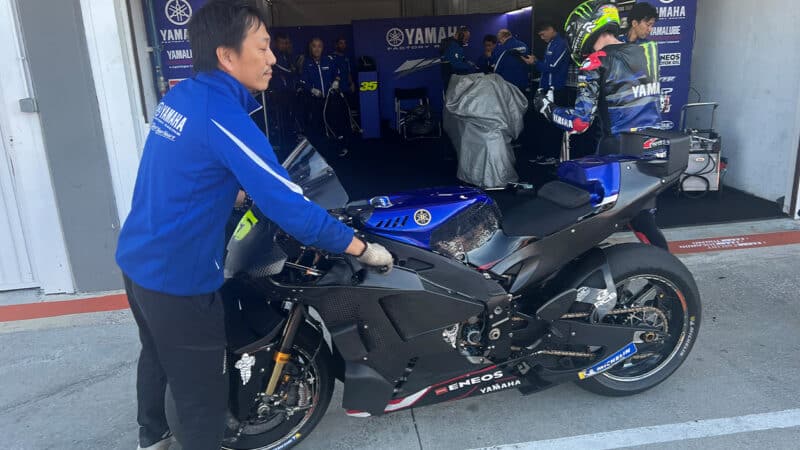 Cal Crutchlow in Yamaha garage with 2024 MotoGP bike at 2023 Valencia post season test