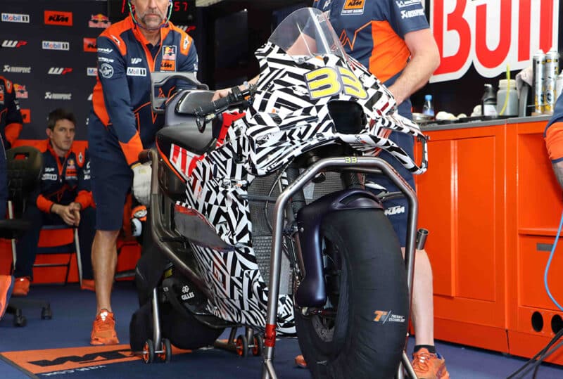 Camouflaged KTM in pit garage at 2023 MotoGP post season Valencia test