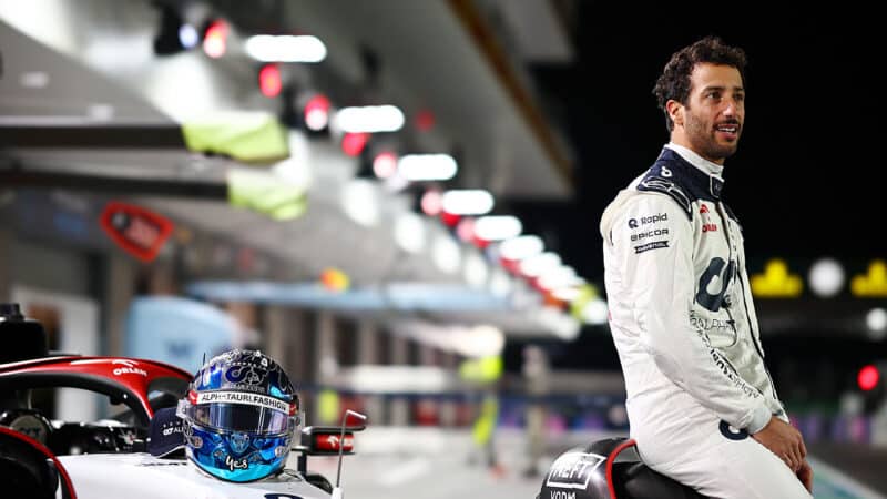 Daniel Ricciardo sits on AlphaTauri F1 car in Las Vegas GP pitlane