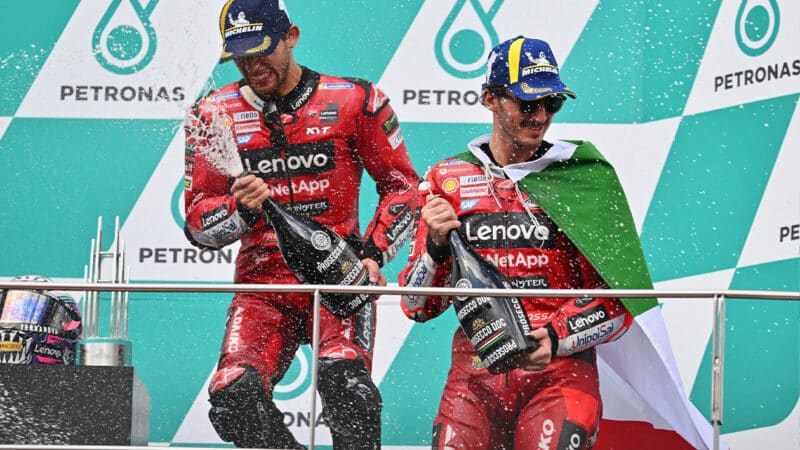 Enea Bastianini and Pecco Bagnaia on podium after 2023 MotoGP Malaysian GP