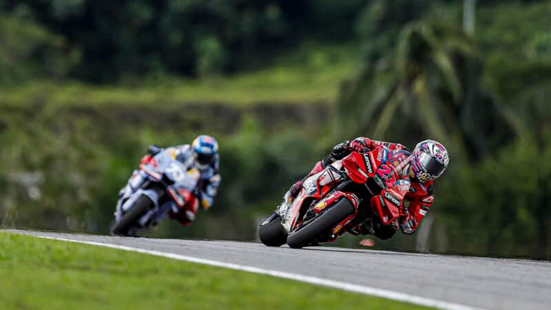Enea Bastianini leads Alex Marquez in 2023 MotoGP Malaysian GP
