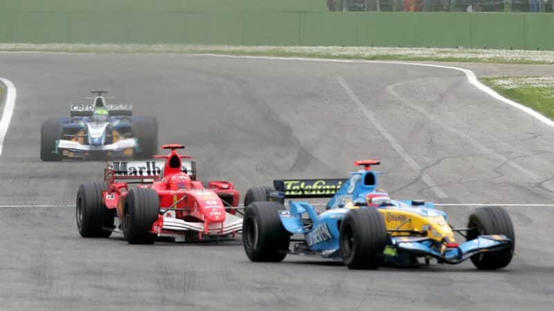 Fernando Alonso defends against Michael Schumacher at the 2005 San Marino Grand Prix