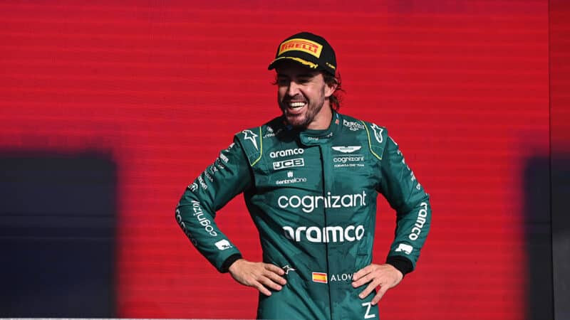 Fernando Alonso smiles on the podium after 2023 Sao Paulo GP