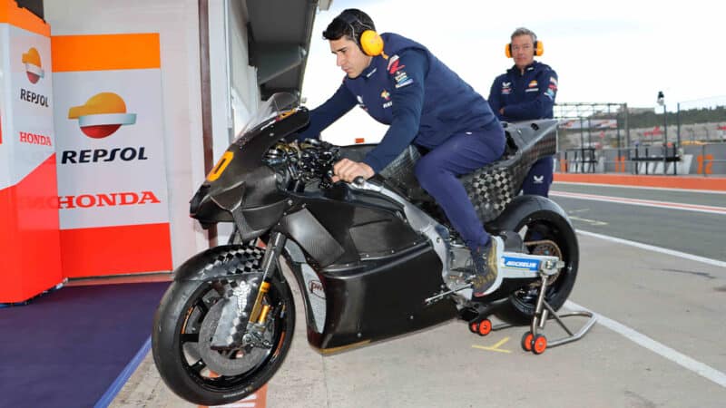 Honda 2024 RC213V wheeled into pit garage at 2023 Valencia post season test